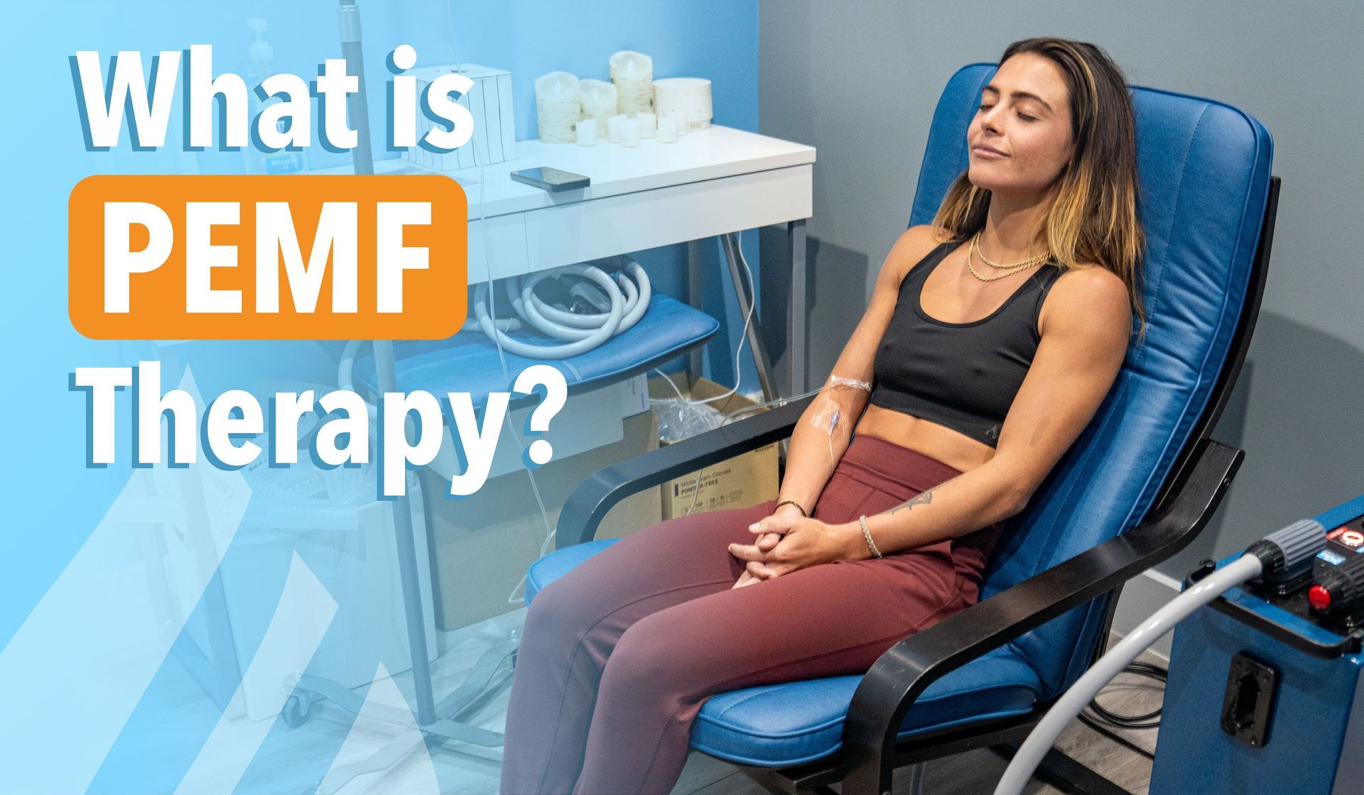 Woman sitting in a blue chair receiving PEMF therapy in a clinical setting.