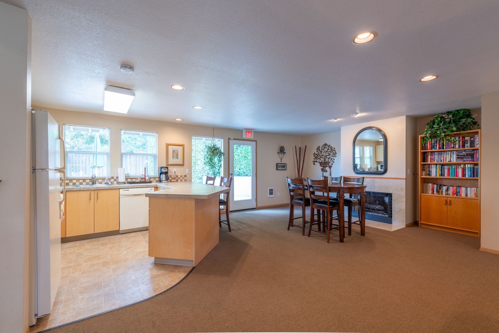 A large room with a table and chairs in it