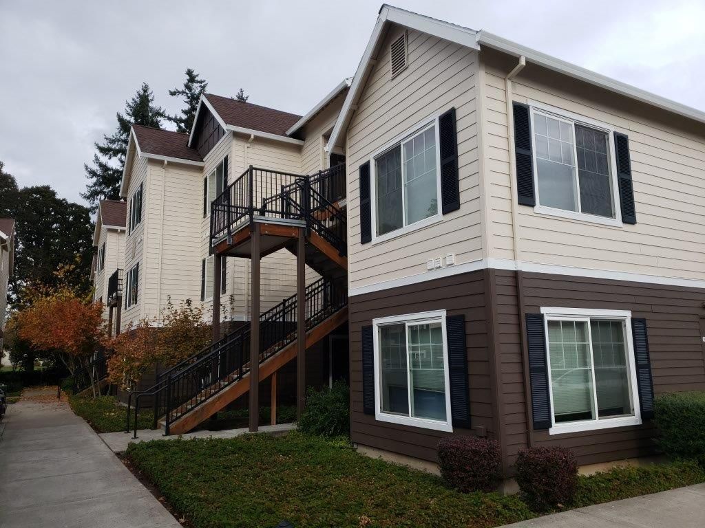 A large house with stairs leading up to the second floor