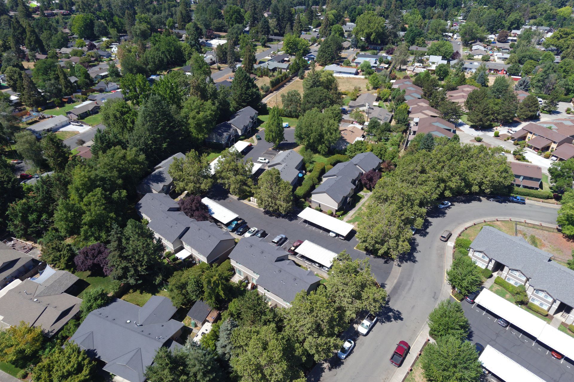 An aerial view of a residential area with lots of houses and trees