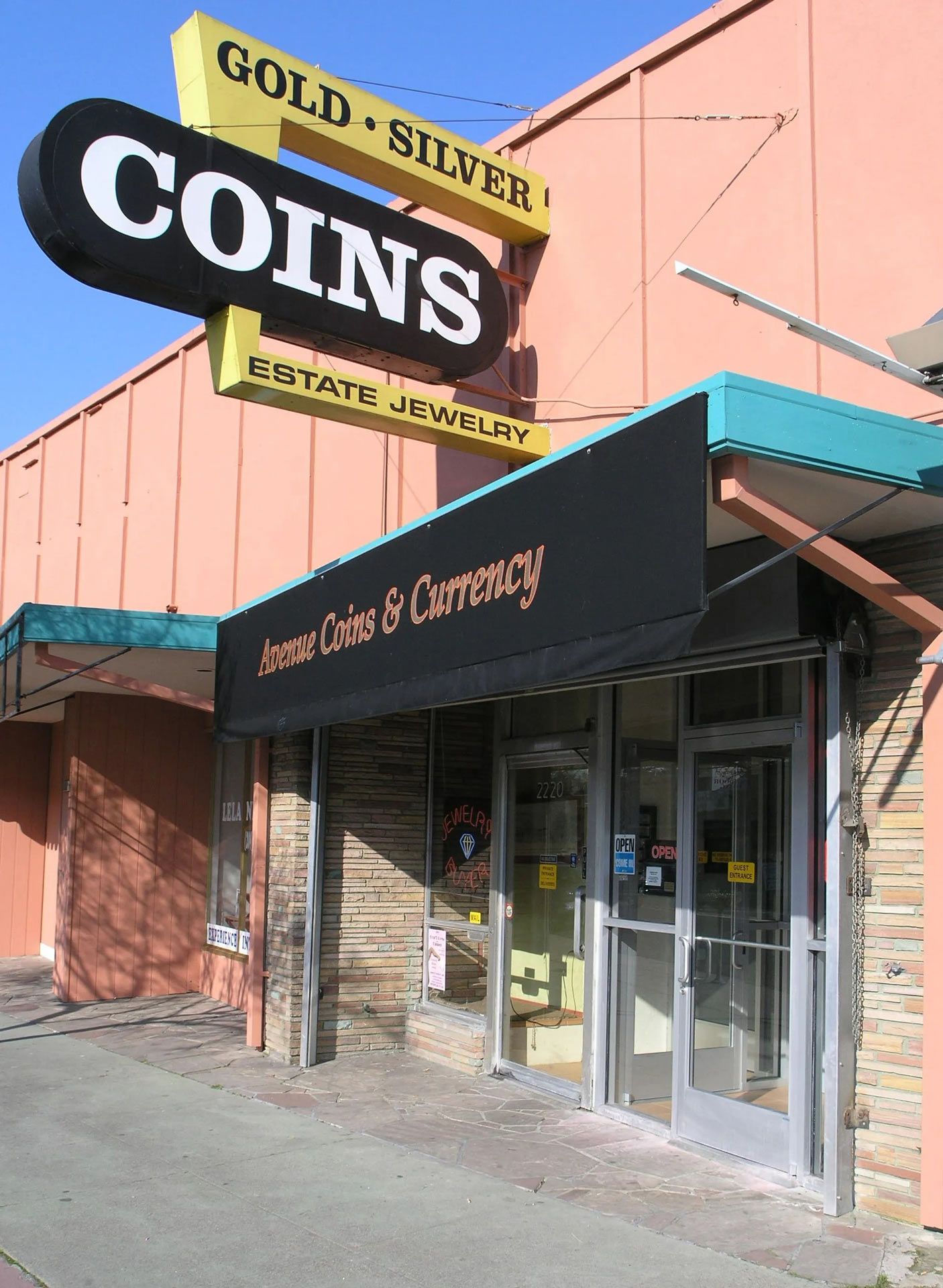 A store front with a sign that says gold silver coins