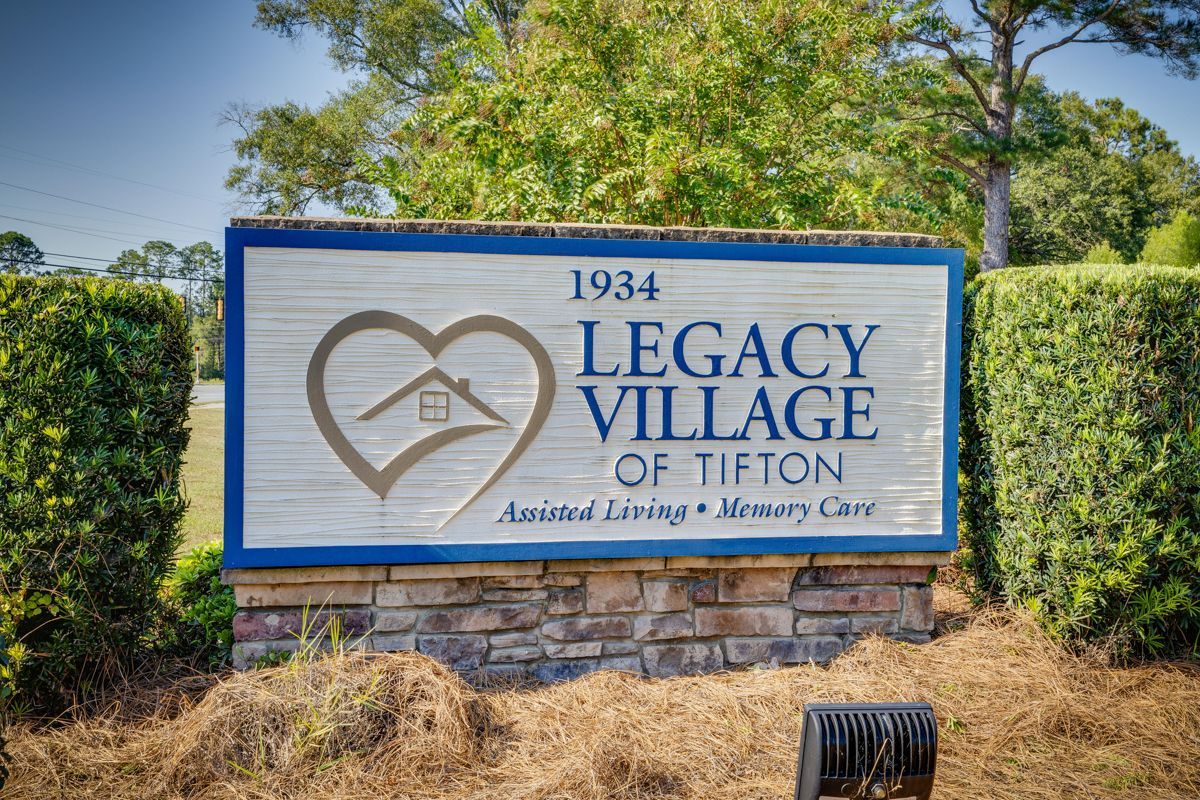 A sign that says legacy village of tifton on it
