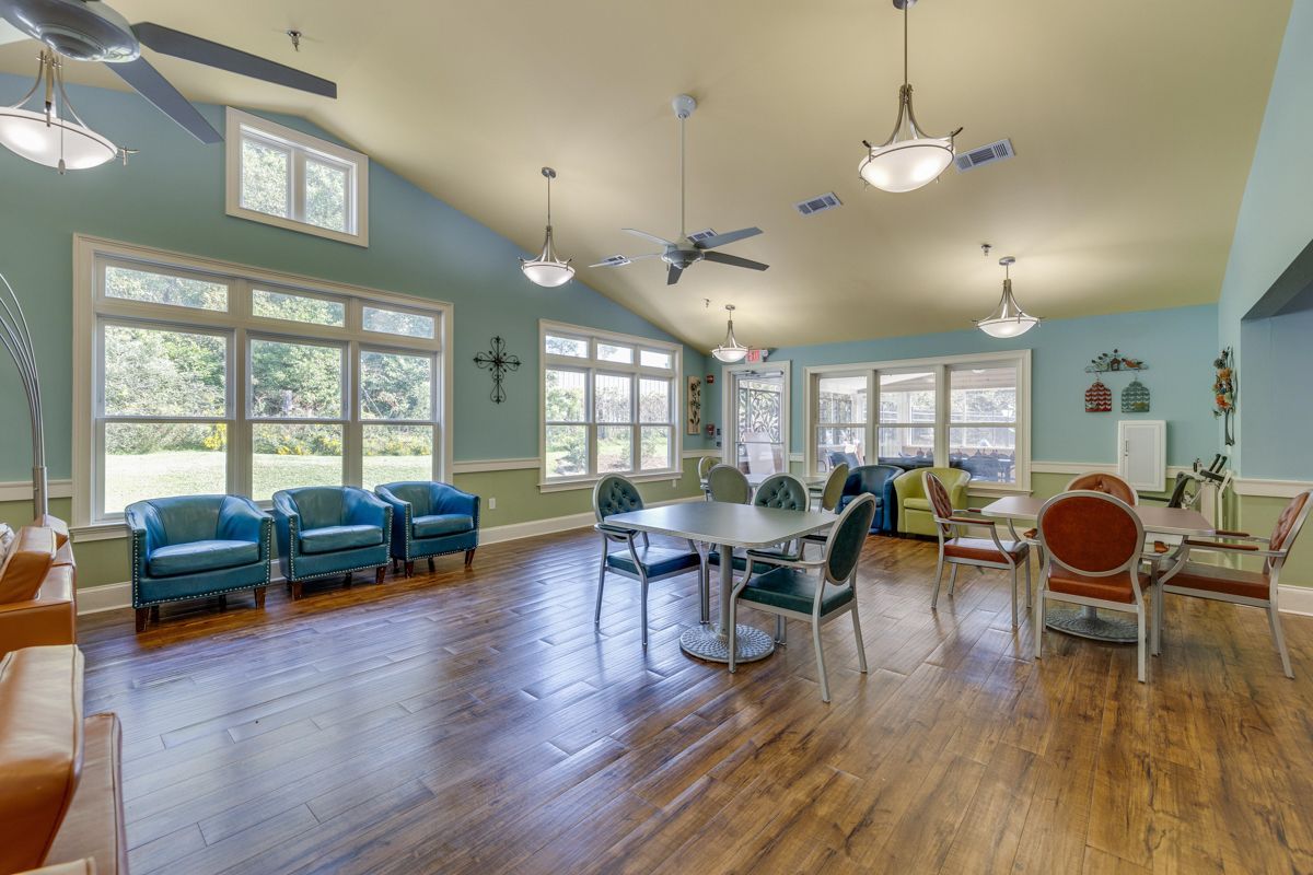 A large room with tables and chairs in it