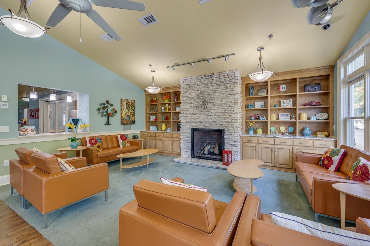 A living room filled with furniture and a fireplace.
