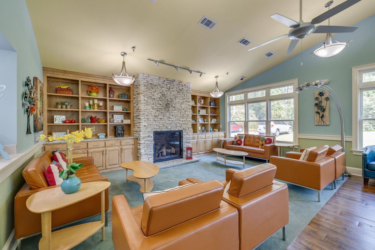 A living room filled with furniture and a fireplace.