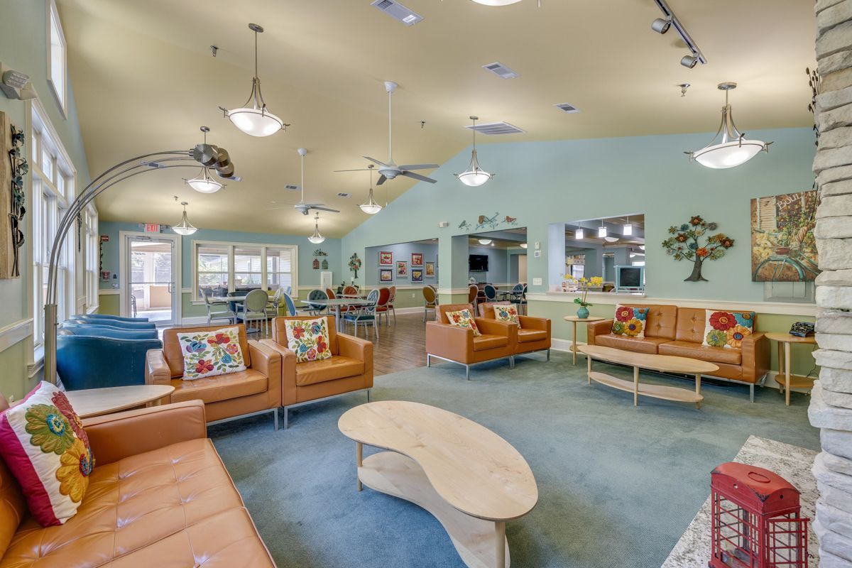 A living room filled with furniture and a fireplace.