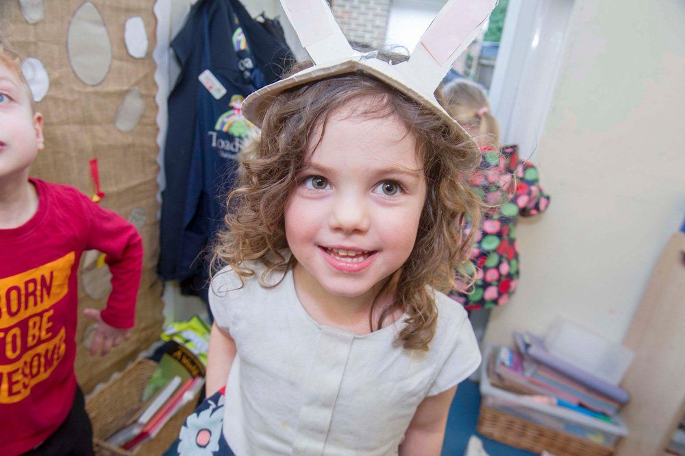 a baby girl wearing a hat