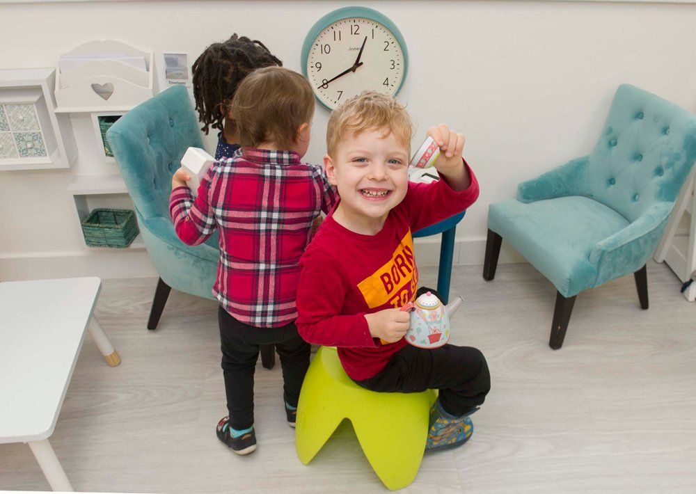 a toddler displaying his toy