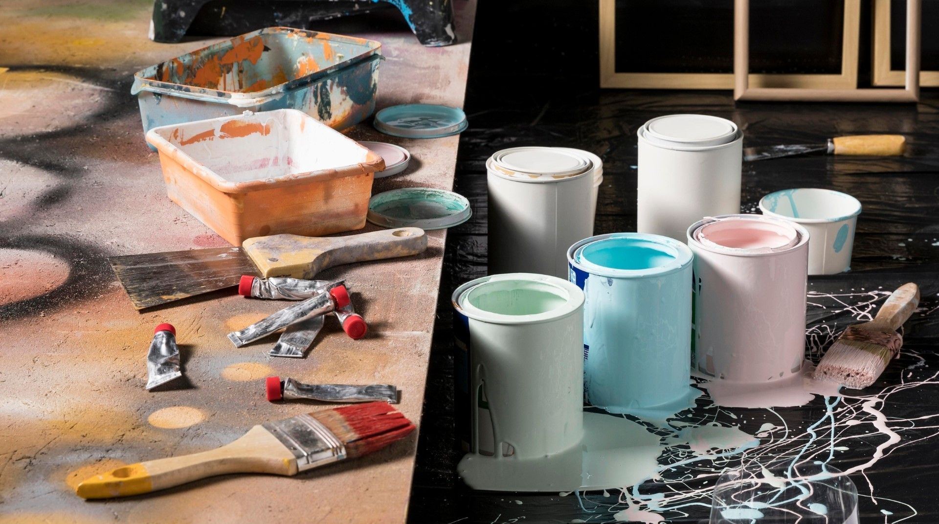 Mac's Junk Removal | A bunch of paint cans and brushes on a table.