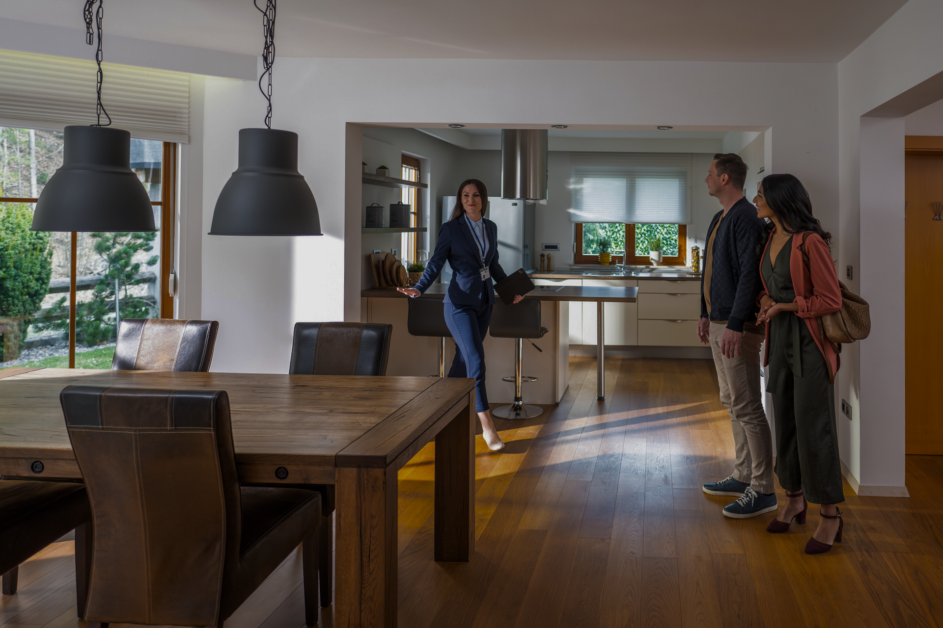 A Woman Is Showing a Man and Woman a House | St. Augustine, FL | Superior Real Estate Services