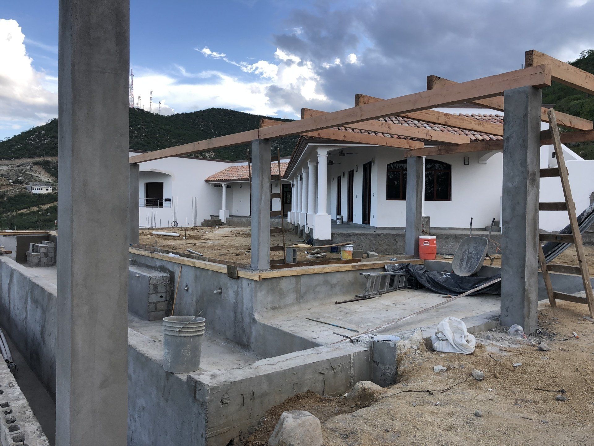 A house that is being built with a ladder in front of it