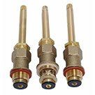 Three brass valve stems with rubber washers on a white background.