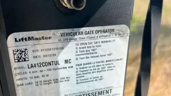 A close up of a label on a lift master vehicular gate operator.