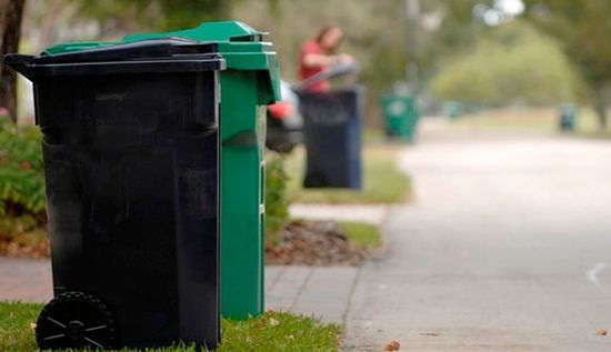 trash bins lined up on residential street in Connecticut