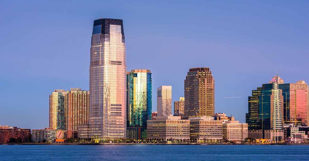 Jersey City skyline at sunset — home to Vibe 35 New Jersey, combining high-energy group workouts and strength training in a 35-minute fitness program.