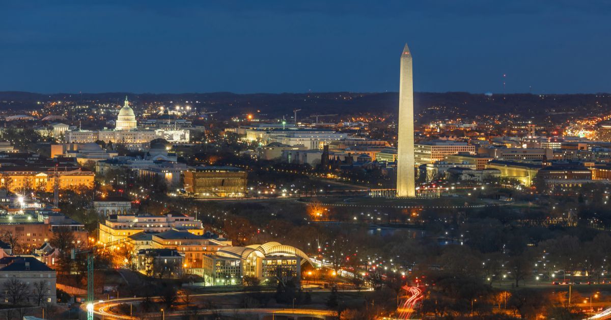 Washington, D.C. skyline at night with the Washington Monument and U.S. Capitol.