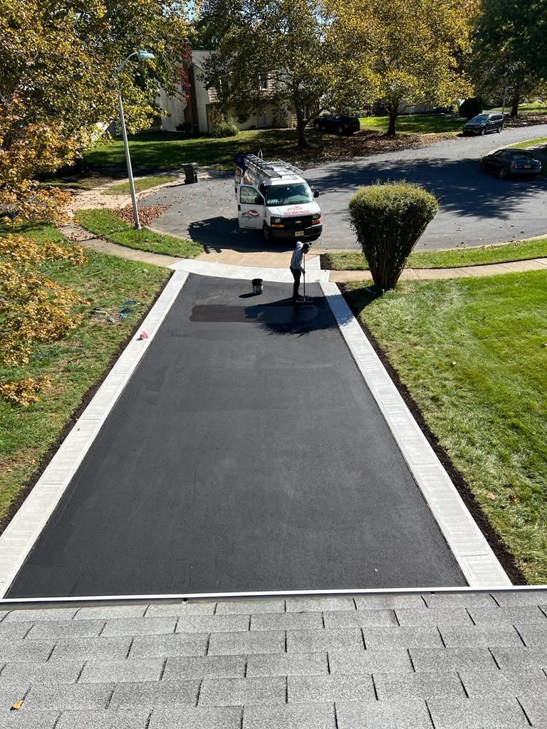 A white van is parked in the driveway of a house.