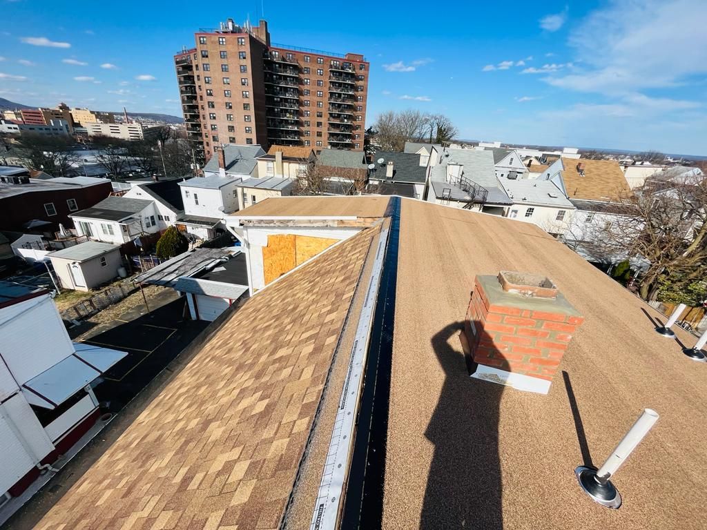 An aerial view of a roof with a chimney on it