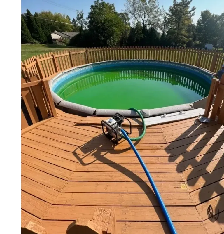 A large swimming pool with a hose attached to it