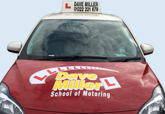 a red dave miller school of motoring car