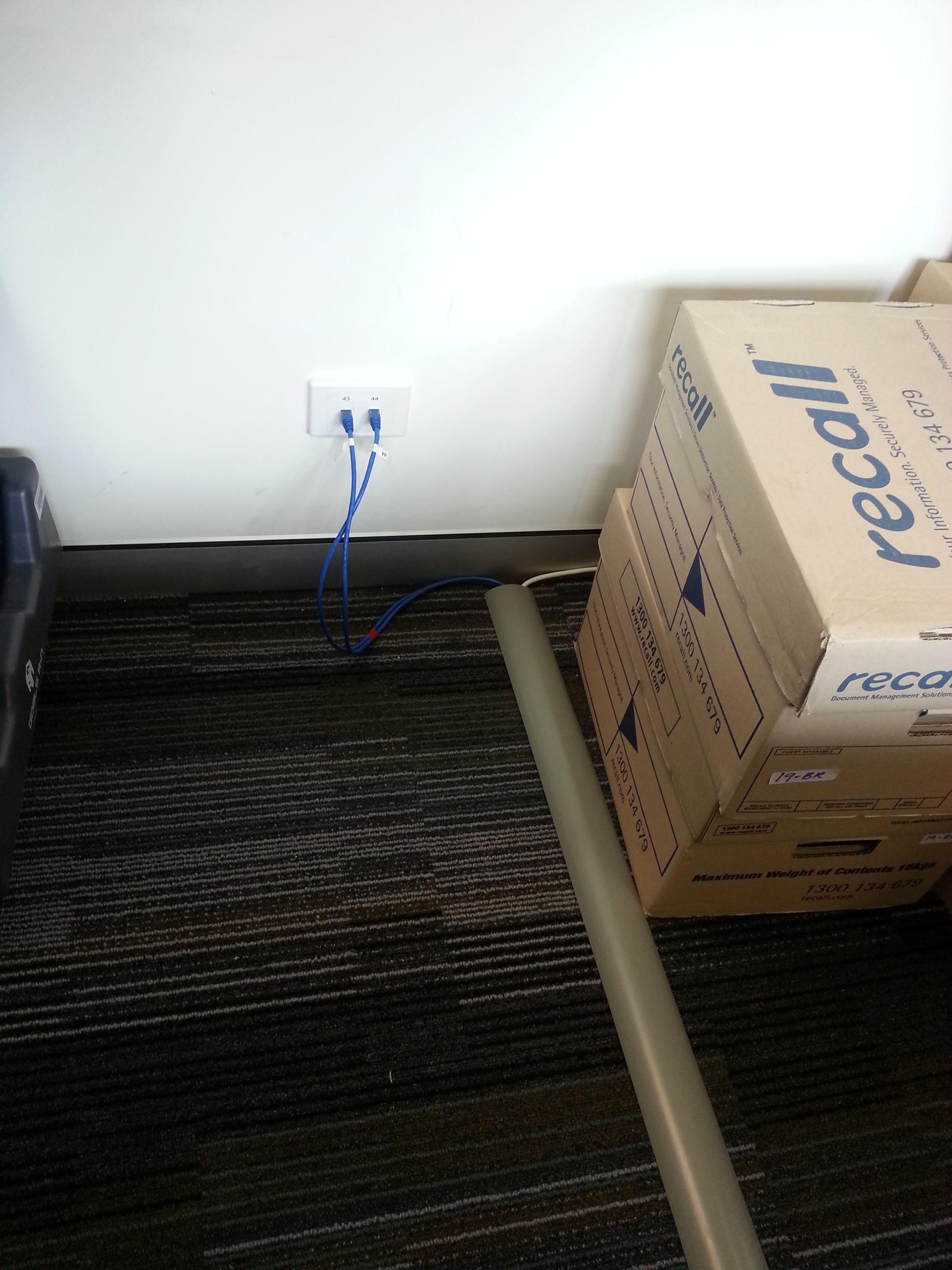 A Stack of Cardboard Boxes With the Word Recall on Them — State Connect In Bangalow, NSW