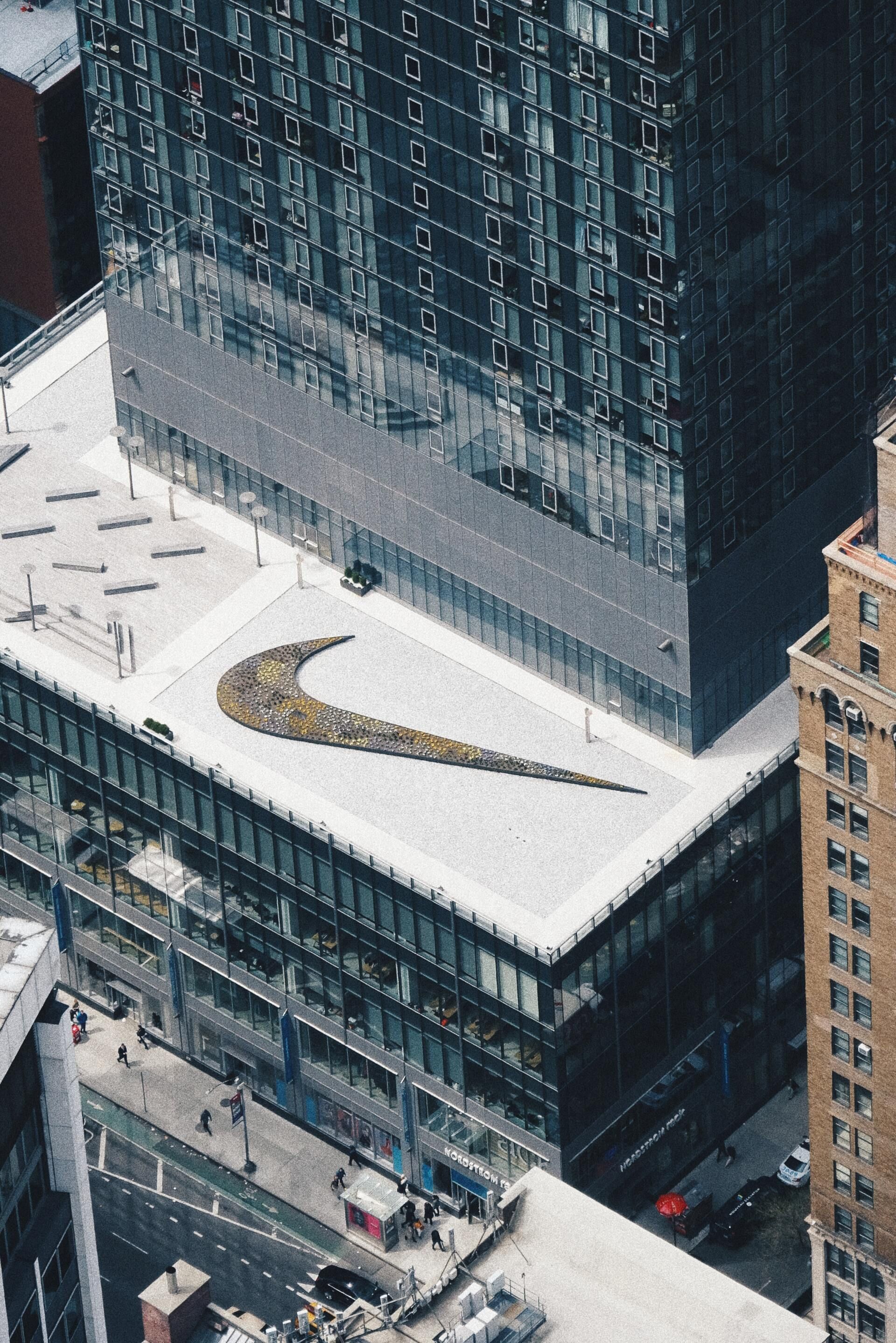 An aerial view of a building with a nike logo on the roof