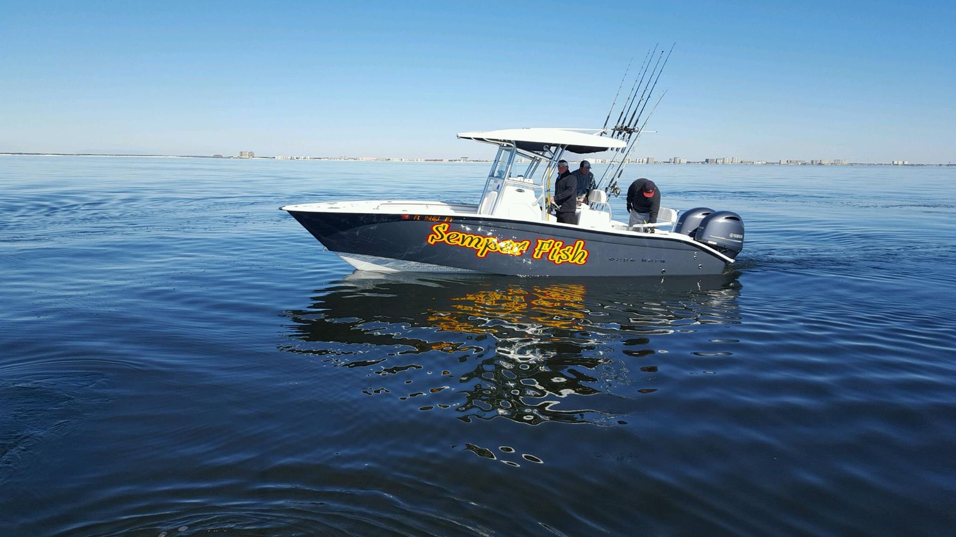 A boat is floating on top of a body of water.