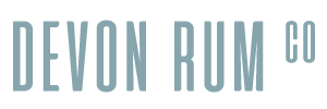 Devon Rum Co logo in a soft blue-gray color.