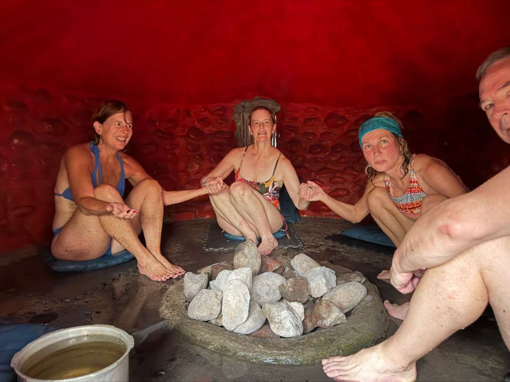 women taking conscious breath with hand on heart and belly