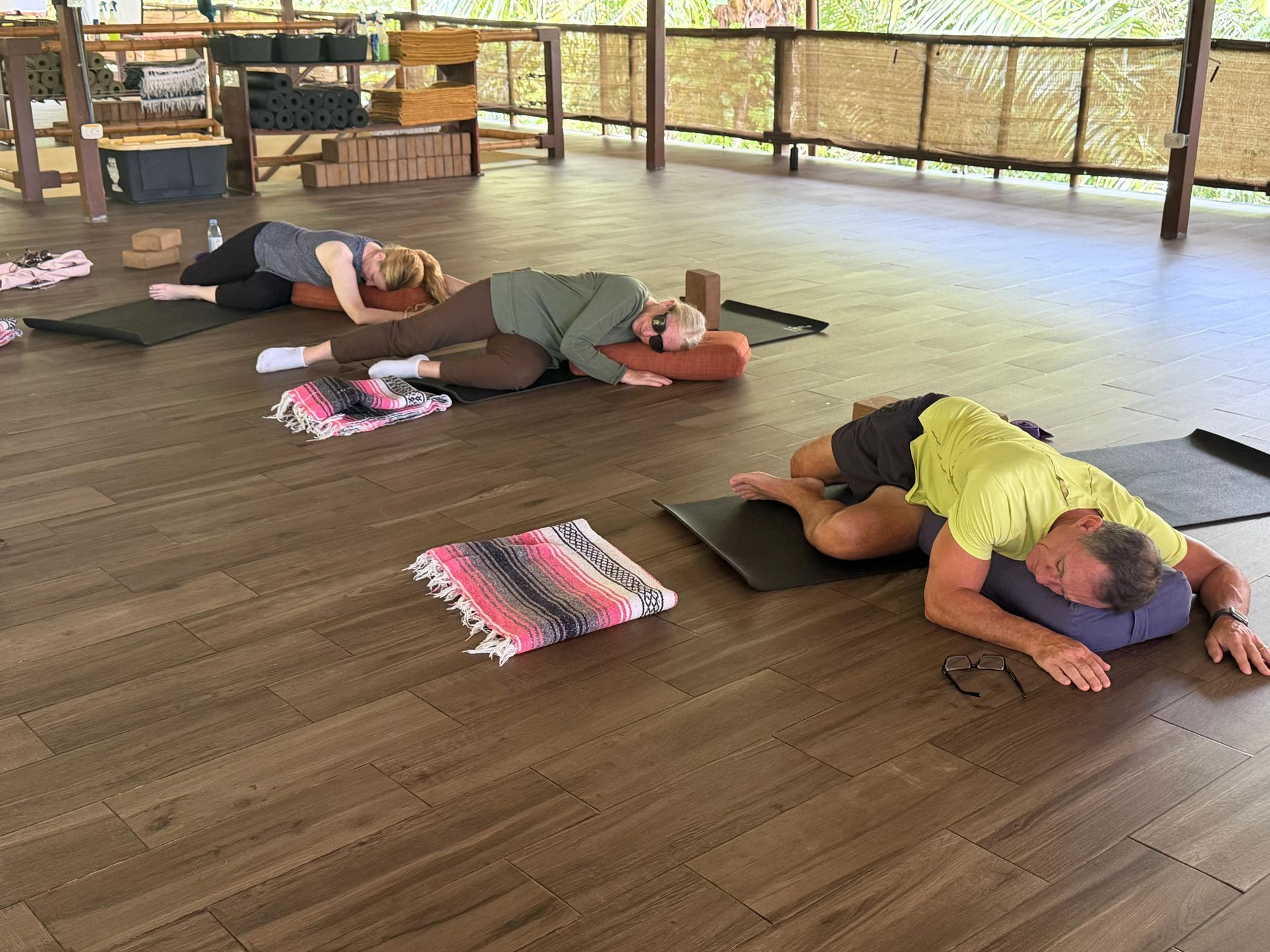 women at the beach, relaxed and arms open 