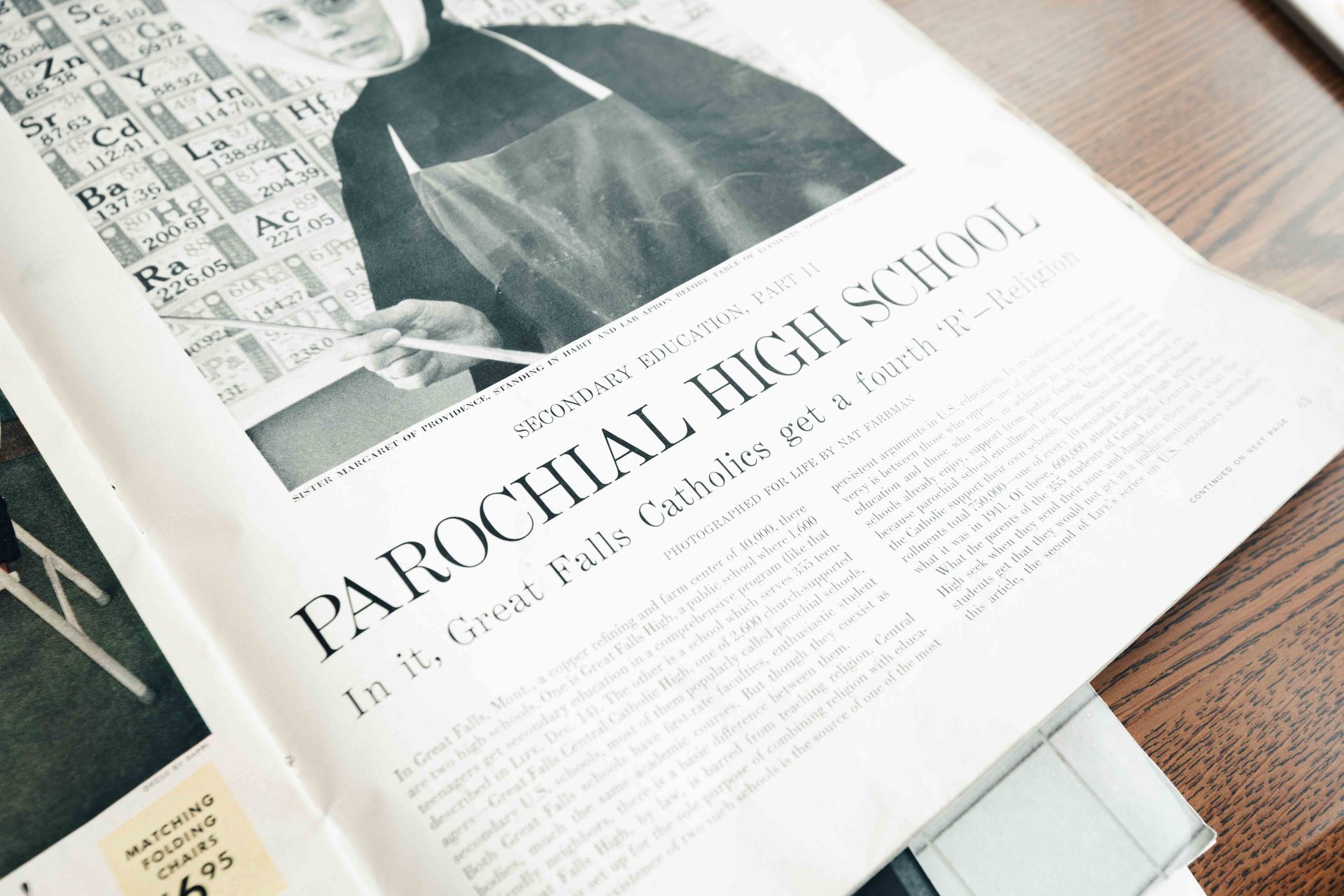 A book is open to a page that says parochial high school