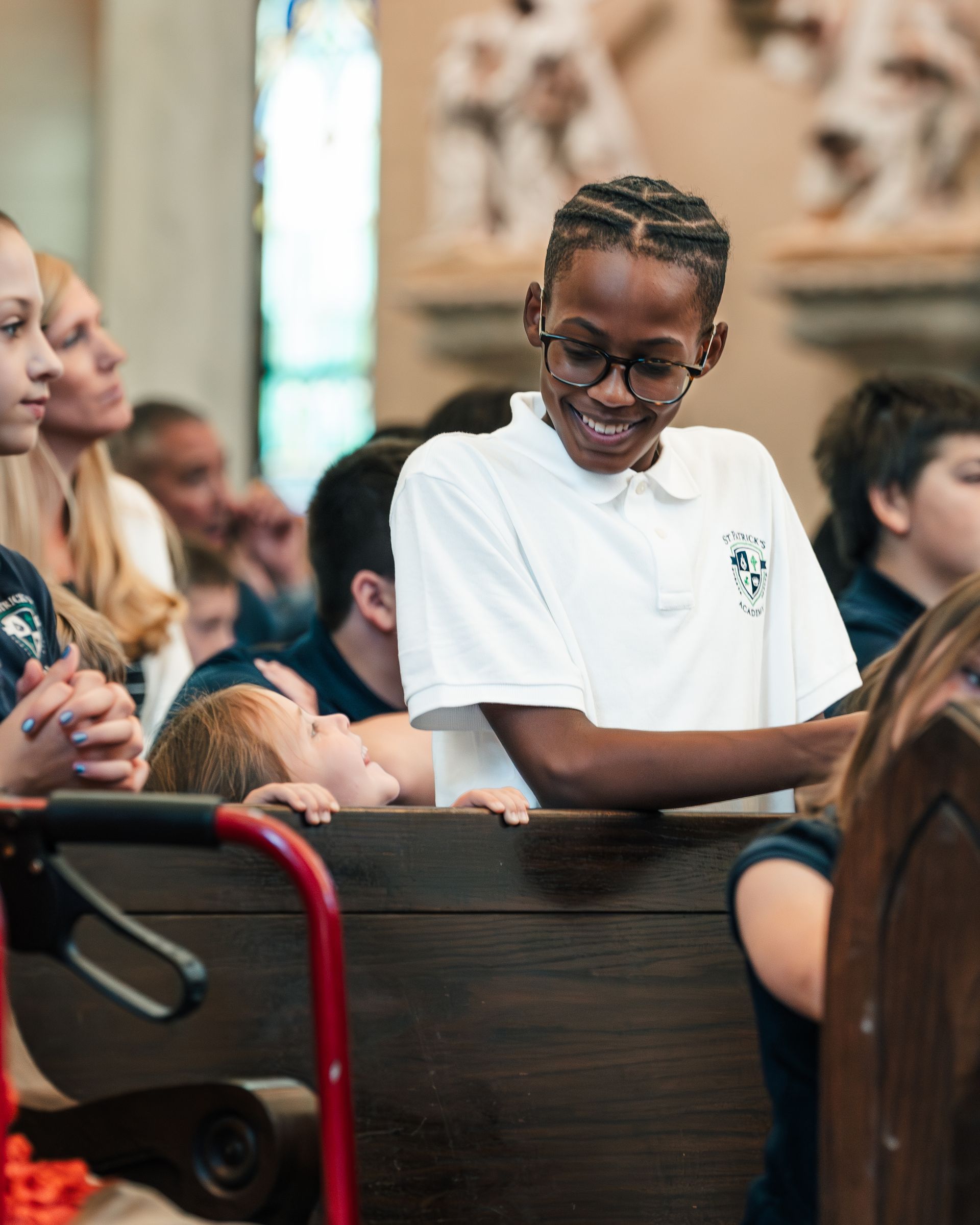 A group of graduates are throwing their caps in the air.
