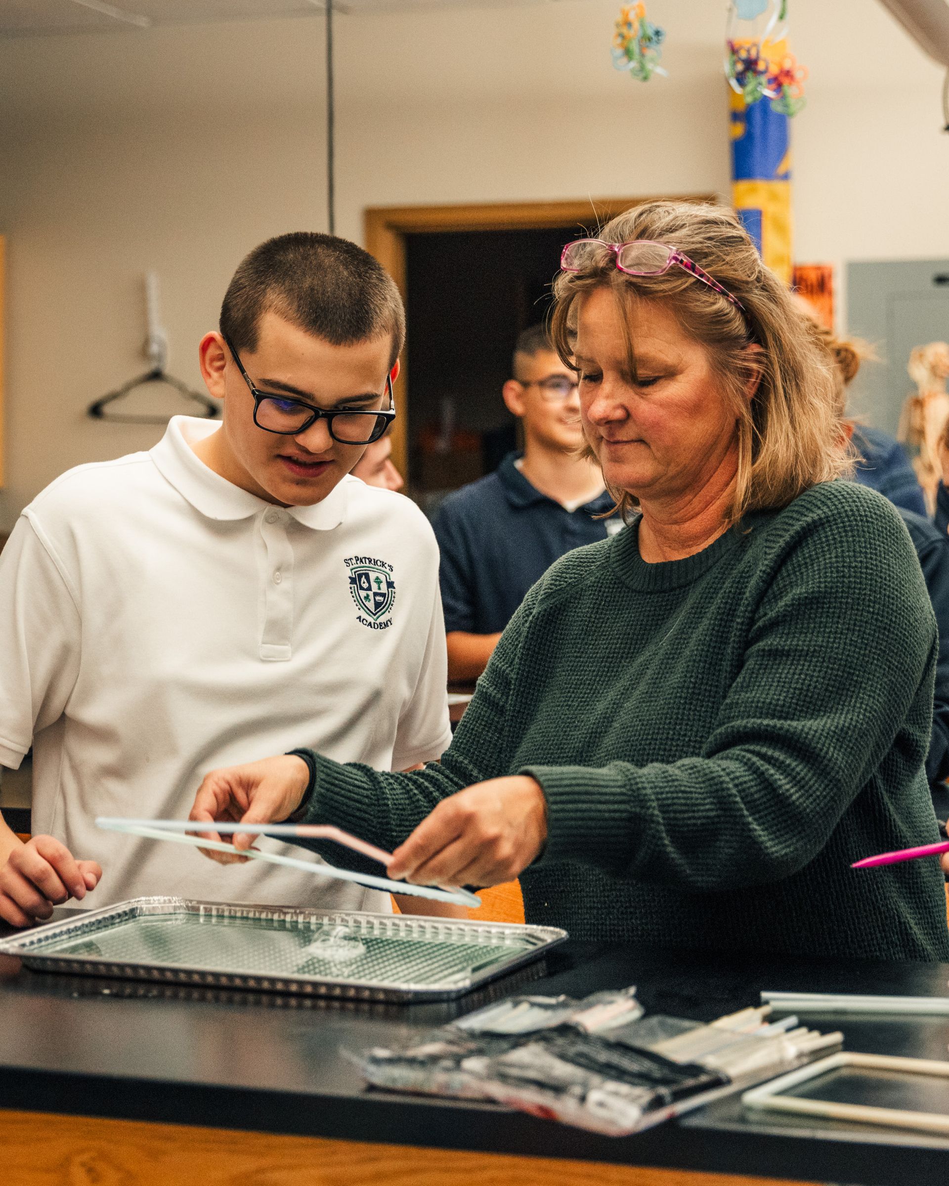 A group of graduates are throwing their caps in the air.