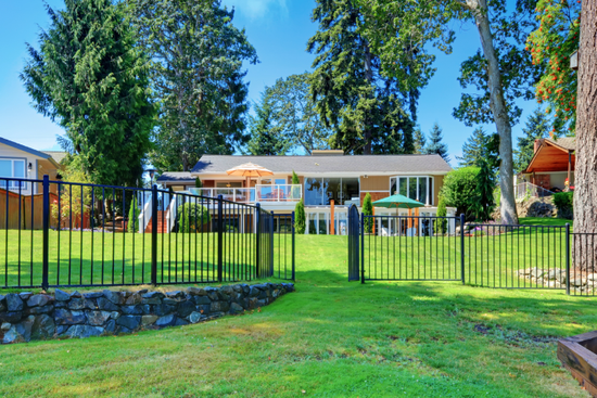 Raleigh home with black aluminum fence in the backyard.