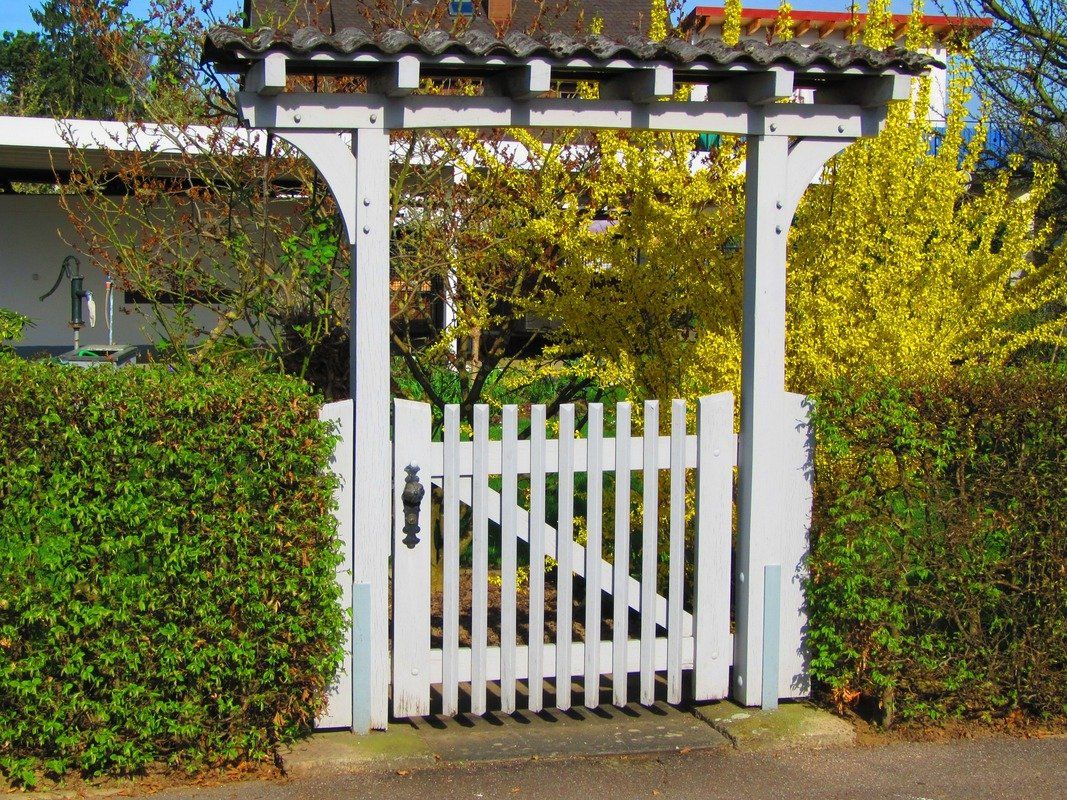 Beautiful custom wooden gate with archway.