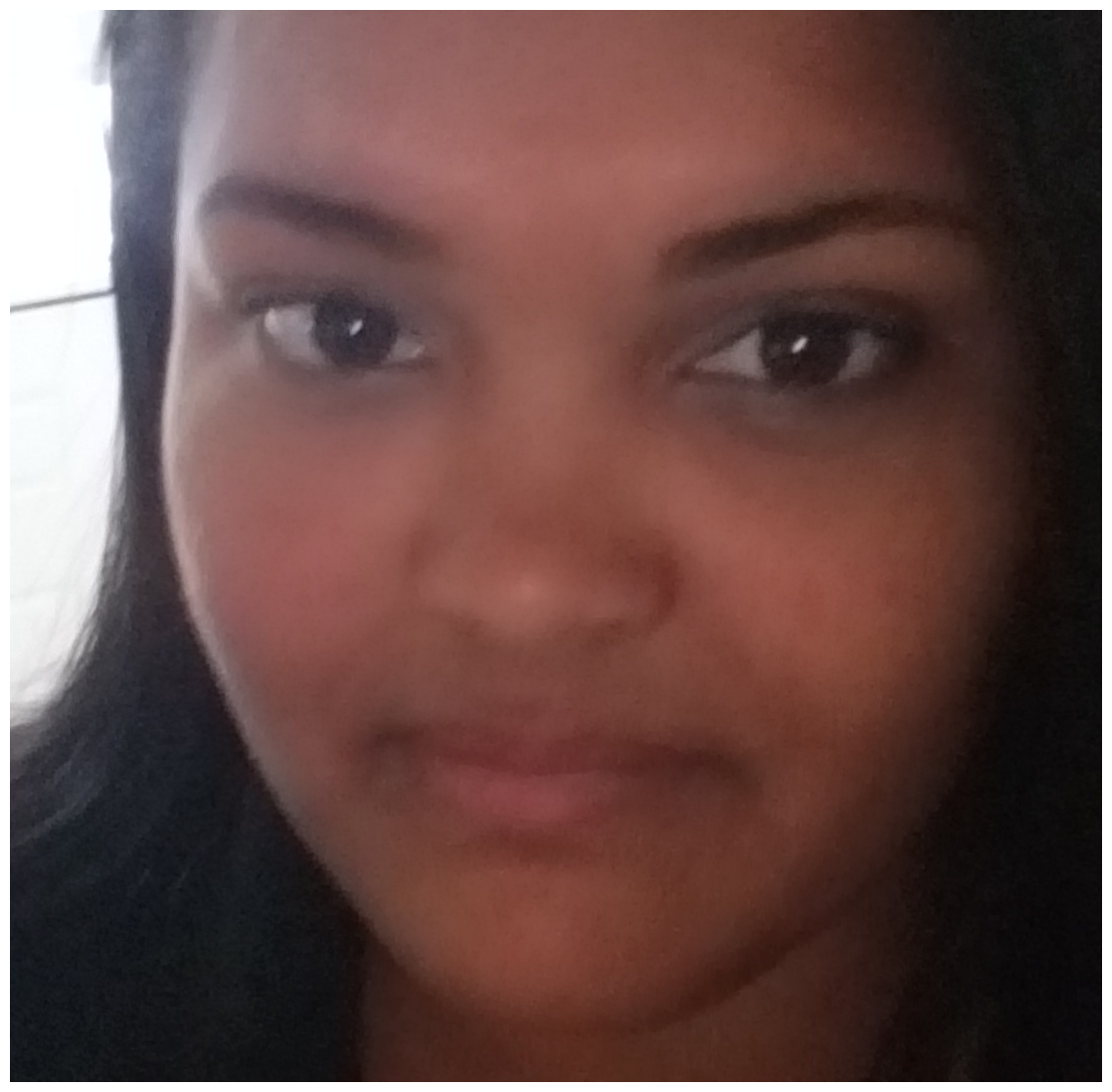 A close up of a woman 's face with a serious look on her face.