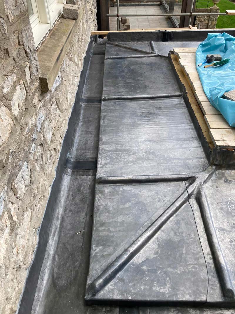Repairing leadwork and flashing on a flat roof