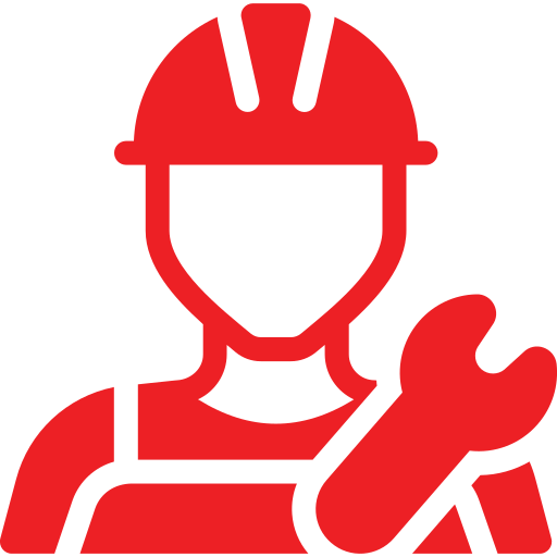 A man wearing a hard hat and overalls is holding a wrench.
