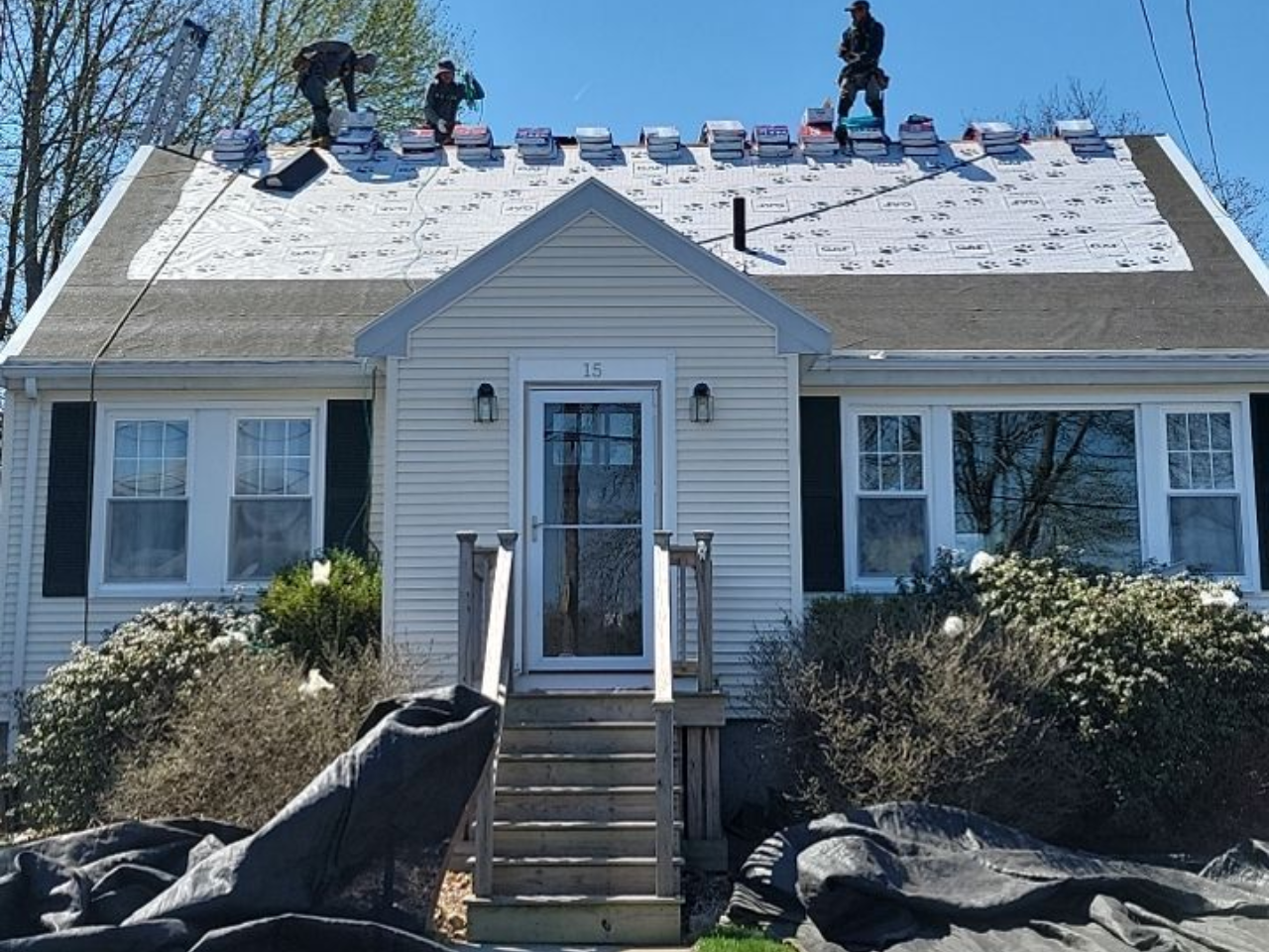 Damaged wooden floor with a square hole exposing dark interior. Boards are splintered and weathered.