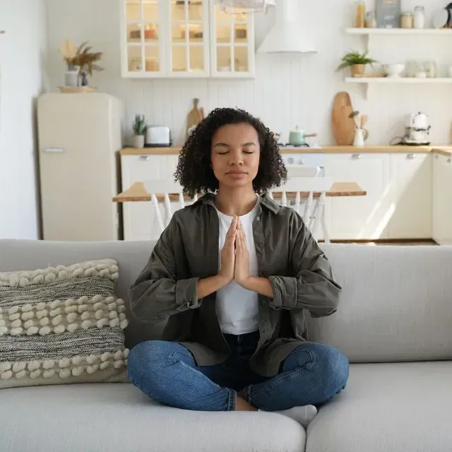 A pair of glasses laying on top of an open book