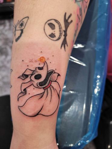 A person has a tattoo of zero from the nightmare before christmas