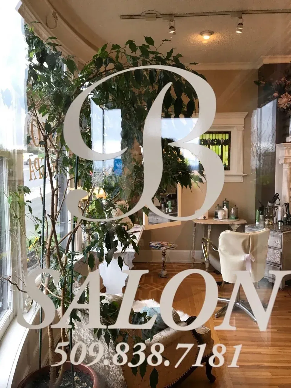 A picture of a salon with a phone number