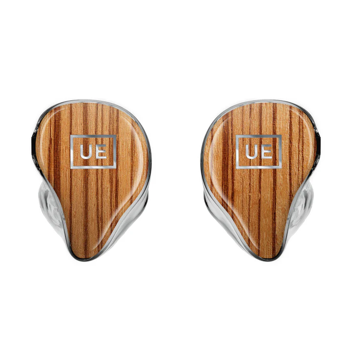 Two custom in-ear monitors with wood grain faceplates and