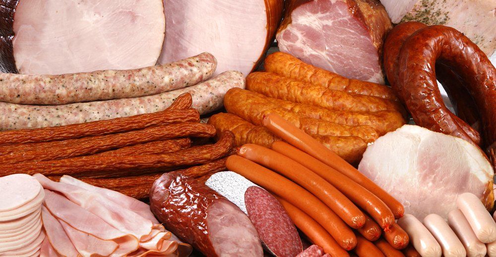 Cutting Sausage and Meat on a Celebratory Table — Byron Bay Pork & Meats Butchery in Mullumbimby, NSW