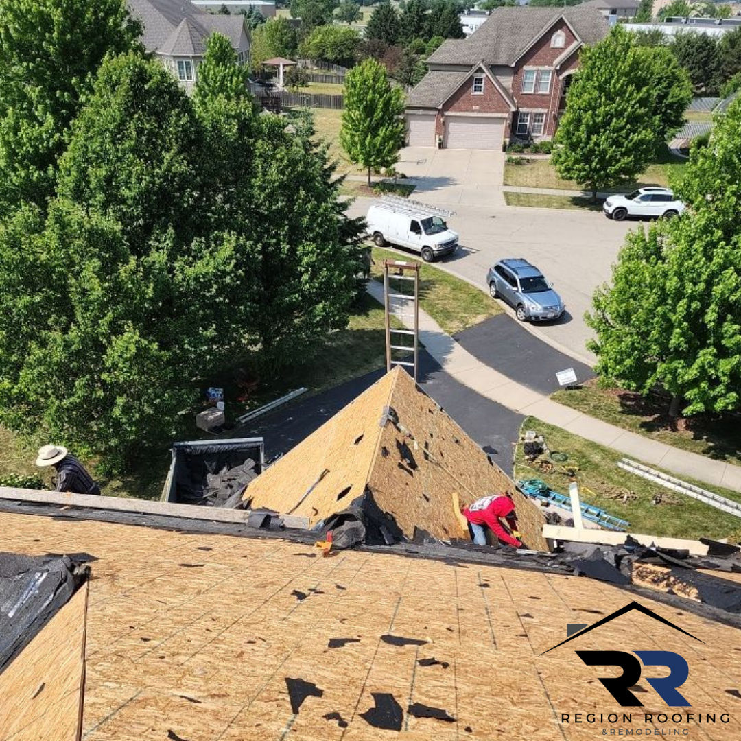 An aerial view of a roof being repaired by rr roofing