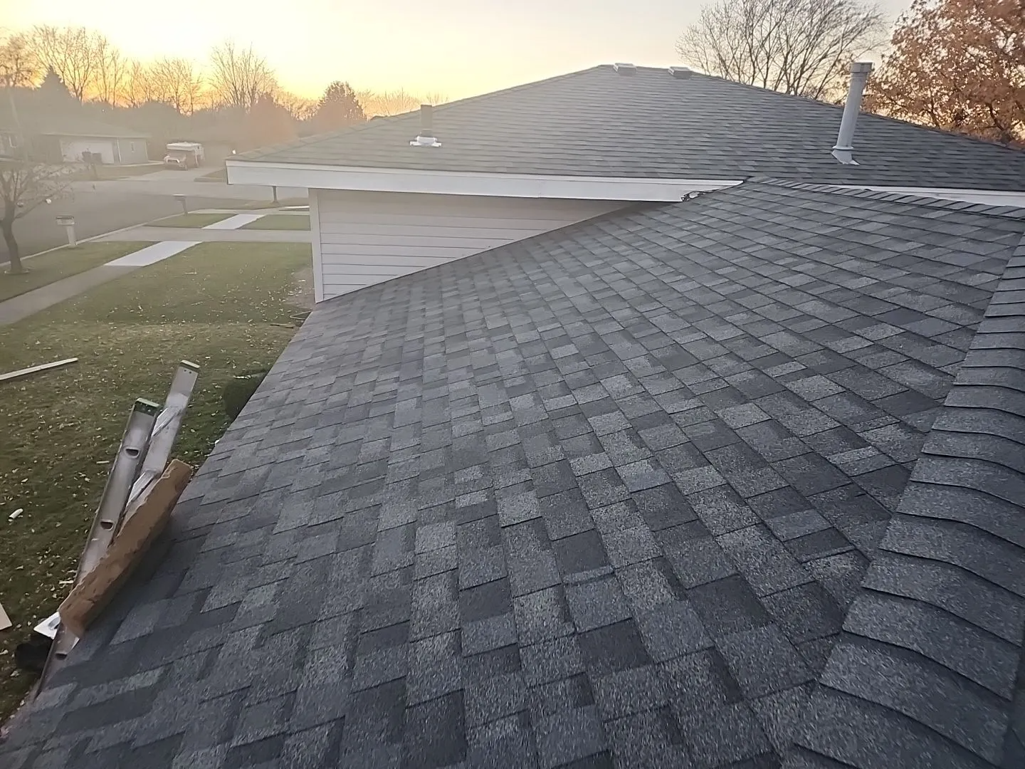 A close up of a roof of a house with shingles on it.