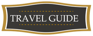 Travel Guide sign in white text on a dark brown plaque with gold border