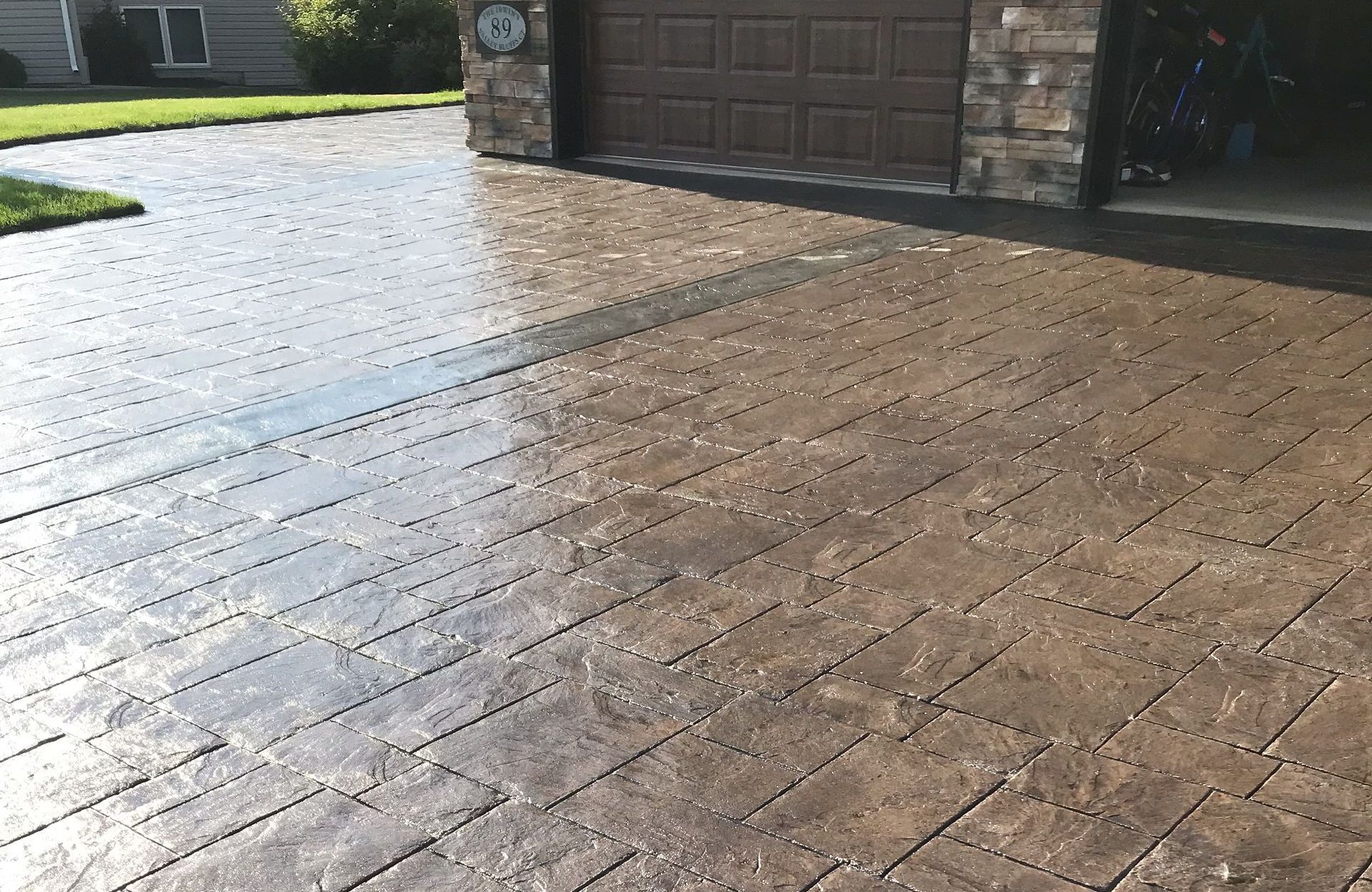 The front of a house with a walkway leading to the front door.