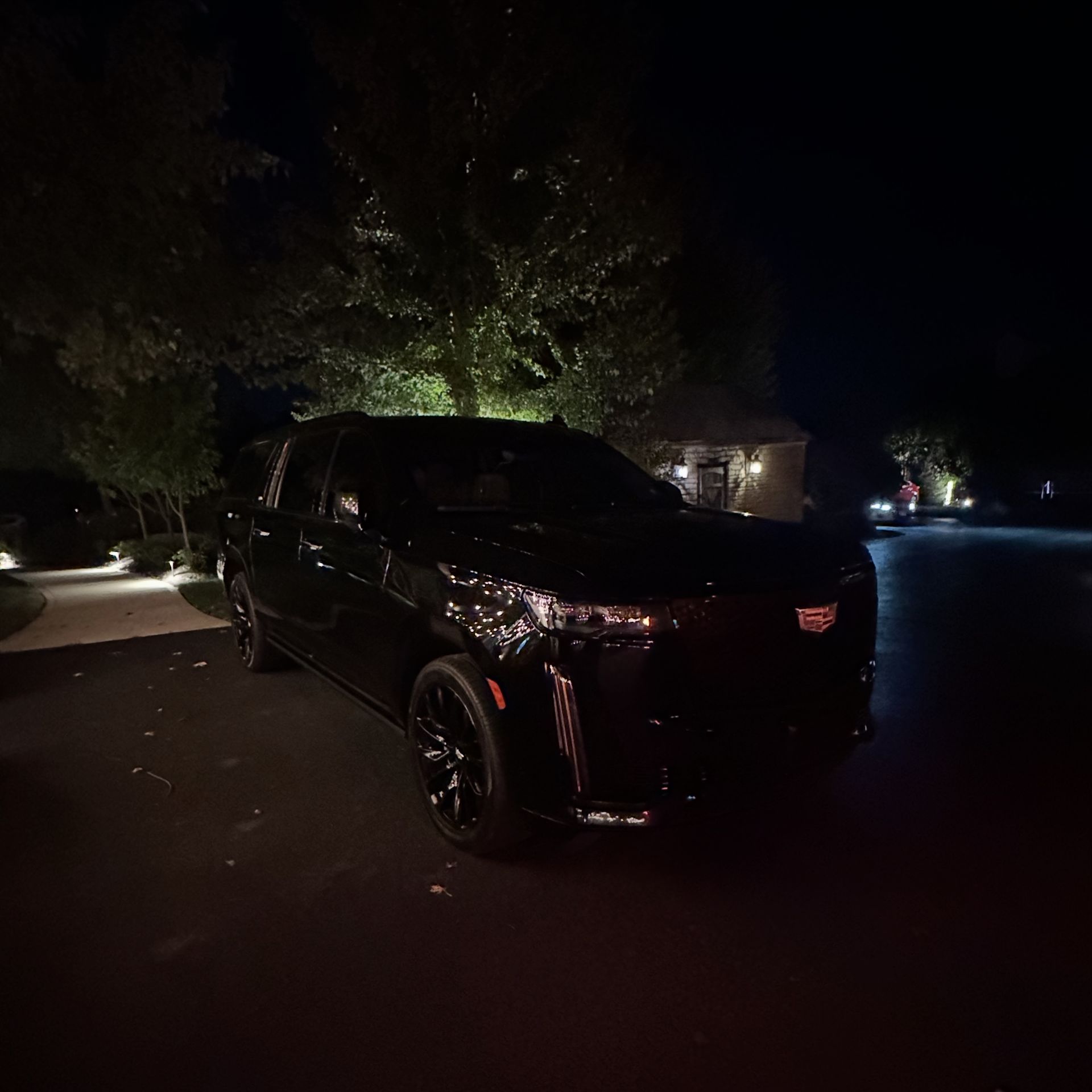 Cadillac Escalade parked at The Farmhouse venue in Plainfield for a wedding event by M.R. Black Car Service.