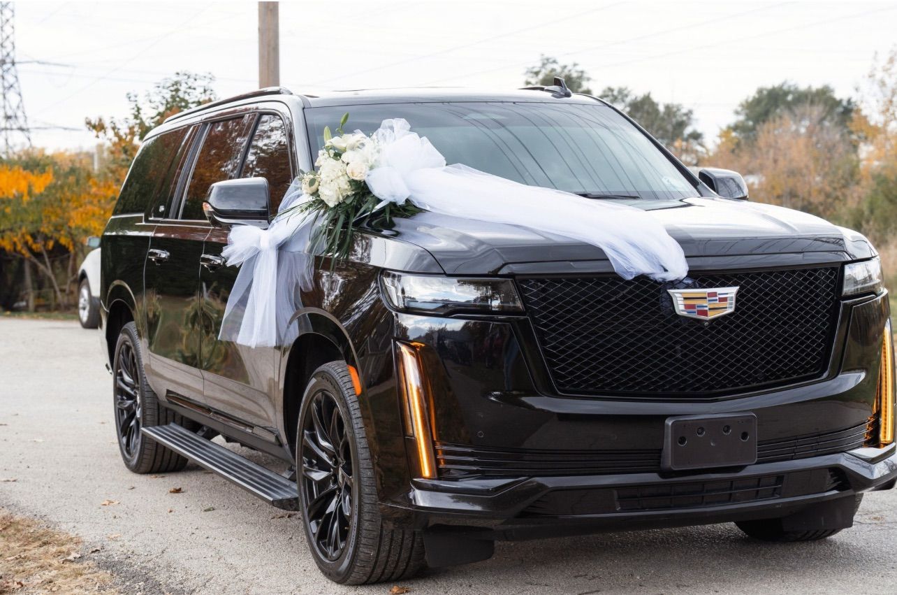 Black Cadillac Escalade with wedding decor as part of luxury car fleet for M.R. Black Car 